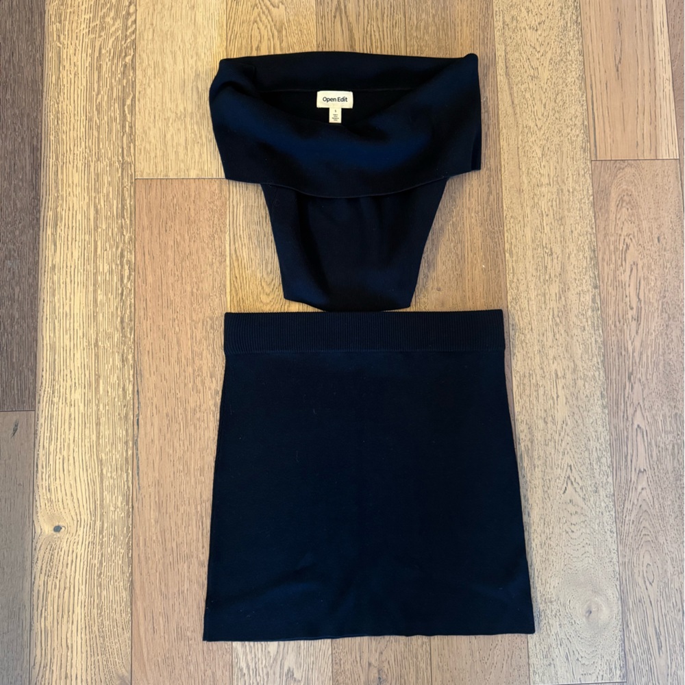 Black knit mini skirt and off the shoulder top size small
Open Edit